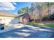 Exterior of two-story brick home with a two-car garage and driveway at 2023 Aragon Ln, Gastonia, NC 28056