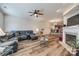 Open living room with L-shaped sectional sofa and fireplace at 2023 Aragon Ln, Gastonia, NC 28056