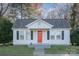 Charming white house with red door, freshly landscaped lawn at 2222 Moose Rd, Kannapolis, NC 28083