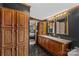 Double vanity bathroom with wood cabinets at 227 Grassy Meadow Ln, Statesville, NC 28625