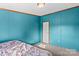 Spacious bedroom with teal walls and carpeted floors at 227 Grassy Meadow Ln, Statesville, NC 28625
