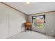 Small bedroom with a desk and window view at 227 Grassy Meadow Ln, Statesville, NC 28625