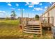 Spacious wooden deck with stairs leading to the yard at 227 Grassy Meadow Ln, Statesville, NC 28625