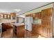 Modern kitchen with wood cabinets, an island, and a refrigerator at 227 Grassy Meadow Ln, Statesville, NC 28625