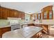 Bright kitchen boasts wood cabinets, a tile countertop, and an electric range at 227 Grassy Meadow Ln, Statesville, NC 28625