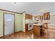 Kitchen features wood cabinets, an island, and a view into the living room at 227 Grassy Meadow Ln, Statesville, NC 28625