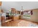 Galley kitchen with wood cabinets and an island at 227 Grassy Meadow Ln, Statesville, NC 28625