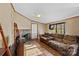 Spacious living room with a fireplace, hardwood floors, and plenty of natural light at 227 Grassy Meadow Ln, Statesville, NC 28625