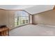 Spacious living room featuring a large arched window at 227 Grassy Meadow Ln, Statesville, NC 28625