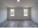 Bright bedroom with two windows and hardwood floors at 2335 Emanuel Church Rd, Rockwell, NC 28138