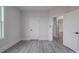 Simple bedroom with gray vinyl flooring and an ensuite bathroom at 2335 Emanuel Church Rd, Rockwell, NC 28138