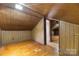 View of attic bedroom with sloped ceilings and hardwood floors at 301 Gold Hill Dr, Salisbury, NC 28146