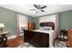 Spacious bedroom with a large bed, hardwood floors, and natural light at 301 Gold Hill Dr, Salisbury, NC 28146