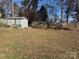 Backyard with shed and wooden fence at 3222 Ole Country Ln, Claremont, NC 28610