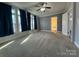 Bright bedroom with carpet flooring and multiple windows at 3222 Ole Country Ln, Claremont, NC 28610