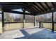 Covered back porch with wooden deck and access to backyard at 3700 Pinecrest Dr, Gastonia, NC 28056