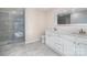Bathroom boasts double vanity, frameless shower, and gray tile floors at 3700 Pinecrest Dr, Gastonia, NC 28056