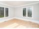 Bright bedroom with hardwood floors and large windows at 3700 Pinecrest Dr, Gastonia, NC 28056
