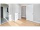 Light-filled bedroom with wood floors and access to a full bathroom at 3700 Pinecrest Dr, Gastonia, NC 28056