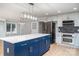 Modern kitchen with blue island, stainless steel appliances, and white shaker cabinets at 3700 Pinecrest Dr, Gastonia, NC 28056