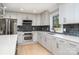 Modern kitchen with gray cabinets and quartz countertops at 3700 Pinecrest Dr, Gastonia, NC 28056