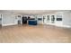 Open concept kitchen with blue island and white shaker cabinets at 3700 Pinecrest Dr, Gastonia, NC 28056