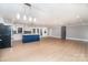 Modern kitchen with white cabinets, blue island, and dark backsplash at 3700 Pinecrest Dr, Gastonia, NC 28056