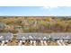 Community overview featuring townhouses and pond at 3950 Rothwood Ln, Harrisburg, NC 28075