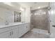 Bathroom with double vanity, large shower, and window at 3950 Rothwood Ln, Harrisburg, NC 28075