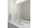 Clean bathroom with white vanity, mirror, and modern fixtures at 3950 Rothwood Ln, Harrisburg, NC 28075