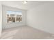 Well-lit bedroom featuring a large window with blinds at 3950 Rothwood Ln, Harrisburg, NC 28075
