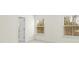 Spacious bedroom with neutral carpeting and two windows at 3950 Rothwood Ln, Harrisburg, NC 28075
