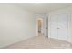 Bright bedroom with double doors leading to a spacious closet and bathroom at 3950 Rothwood Ln, Harrisburg, NC 28075