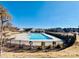 Large community pool with a fence at 3950 Rothwood Ln, Harrisburg, NC 28075