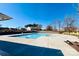 Relaxing community pool with surrounding patio at 3950 Rothwood Ln, Harrisburg, NC 28075