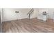 Open concept living room with hardwood floors and kitchen views at 3950 Rothwood Ln, Harrisburg, NC 28075