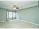 Spacious bedroom with neutral walls, ceiling fan, and ample natural light at 401 N Church St # 504, Charlotte, NC 28202