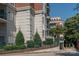 Brick building with green metal roof and landscaping at 401 N Church St # 504, Charlotte, NC 28202