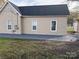 Tan house exterior with a new concrete patio and yard at 427 E Cemetery St, Salisbury, NC 28144