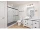 Modern bathroom with marble shower and white vanity at 429 Dare Dr, Charlotte, NC 28206