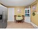 Bright kitchen features a breakfast nook and built-in hutch at 4356 Charles Raper Jonas Hwy, Alexis, NC 28006