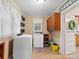 Functional laundry room with washer, dryer, and storage at 4356 Charles Raper Jonas Hwy, Alexis, NC 28006