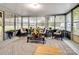 Relaxing sunroom with wicker furniture and view of backyard at 4356 Charles Raper Jonas Hwy, Alexis, NC 28006