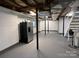 Unfinished basement with refrigerator and stairs at 4541 Hall Dairy Rd, Claremont, NC 28610