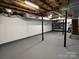 Unfinished basement with painted walls and epoxy flooring at 4541 Hall Dairy Rd, Claremont, NC 28610