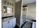 Updated bathroom with a white vanity and marble shower at 4541 Hall Dairy Rd, Claremont, NC 28610