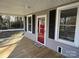 Front porch with red door and black shutters at 4541 Hall Dairy Rd, Claremont, NC 28610