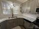 Modern kitchen with gray cabinets and granite countertops at 4541 Hall Dairy Rd, Claremont, NC 28610