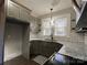 Updated kitchen with gray cabinets and granite countertops at 4541 Hall Dairy Rd, Claremont, NC 28610