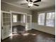 Sunlit living room with hardwood floors and French doors at 4541 Hall Dairy Rd, Claremont, NC 28610